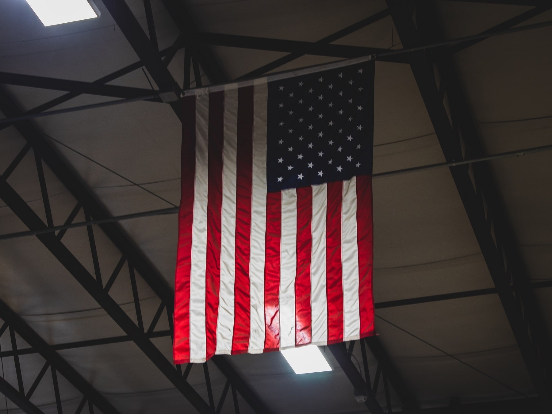 american flag in steel green manufacturing facility