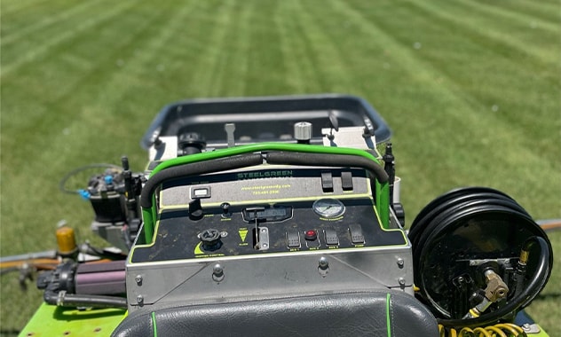 machine cutting grass close-up
