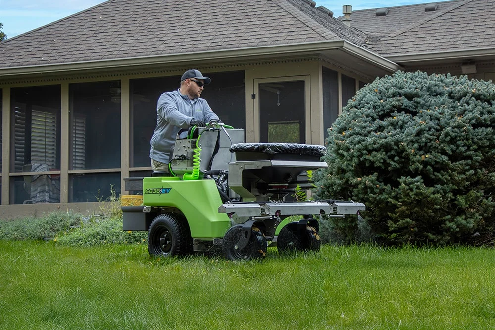 steel green employee riding SG36EV machine