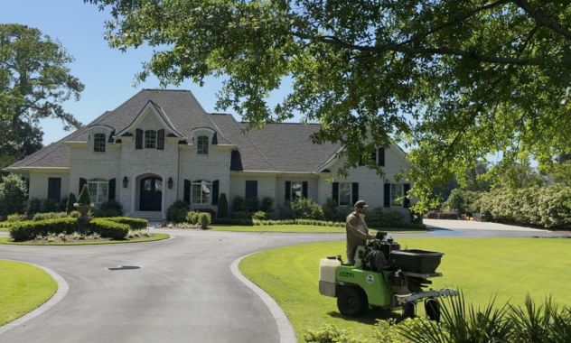 gentleman riding machine and beautiful house
